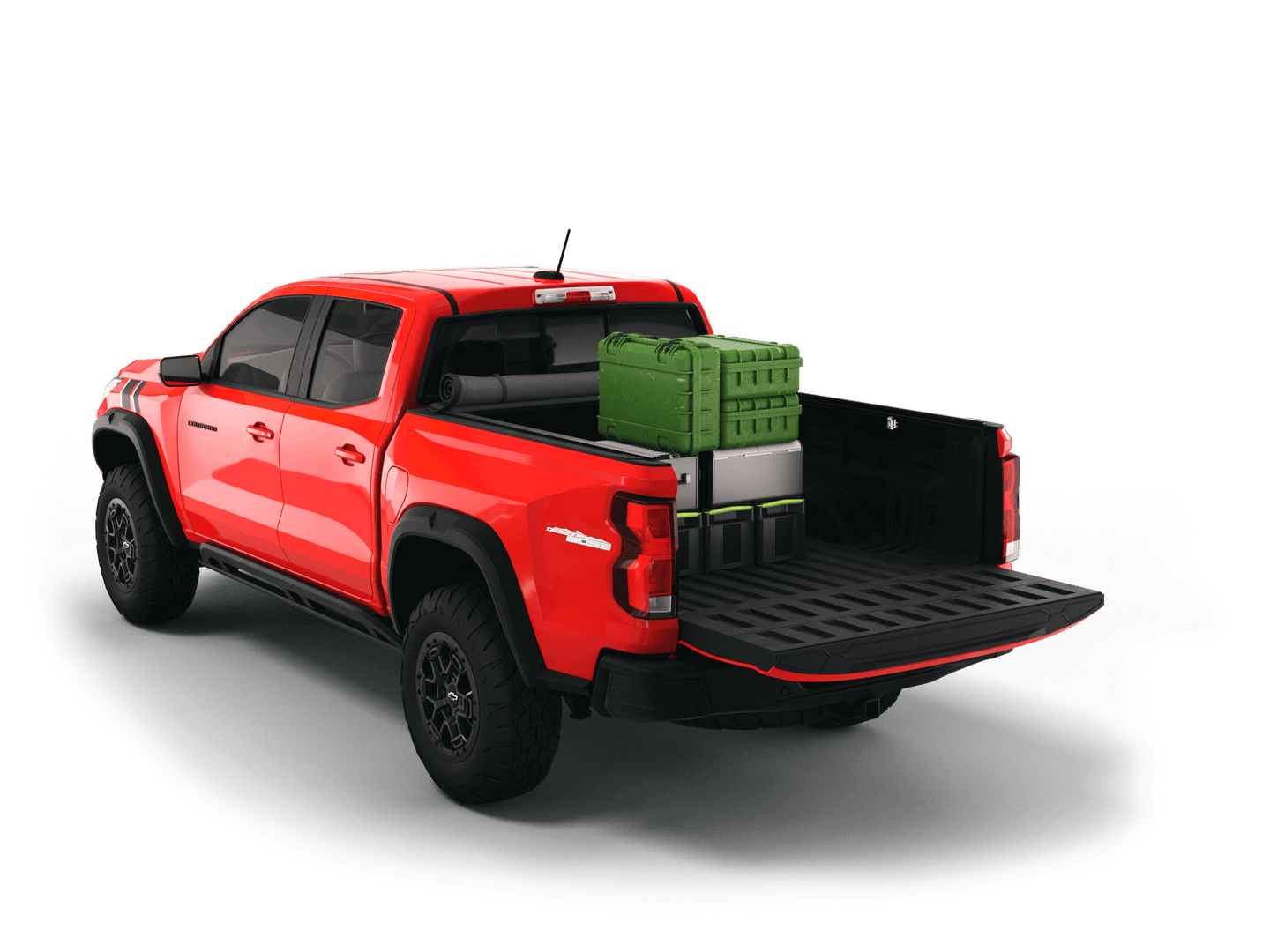 Red Chevrolet Colorado / GMC Canyon with gear in the truck bed and the Sawtooth Stretch tonneau cover rolled up at cab 